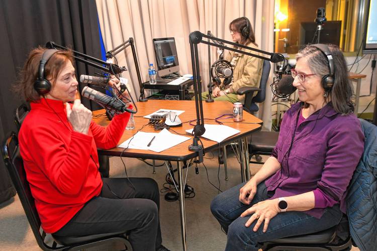 Podcast host Denise Schwartz talks with dance instructor Emily Fox in a studio at Greenfield Community College about how dance is good exercise for older people. In background is sound engineer Nina Bocko.