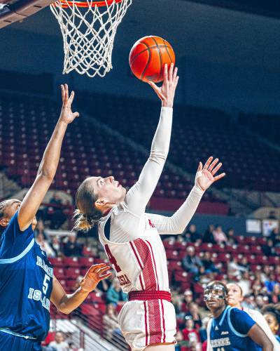 UMass guard Stefanie Kulesza (44) converts an acrobatic layup during the first half of the Minutewomen’s 42-40 loss to Rhode Island earlier this season at Mullins Center in Amherst.